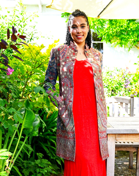 Paisley-dapple cashmere-silk jacket in browns, pinks and turquoise, nehru collar, handwoven, fully lined, Nelly front open, garden view