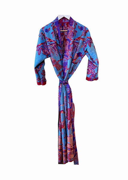 Freya-robe-cashmere-tropical-reds-turquoise-reversible-turquoise-side
