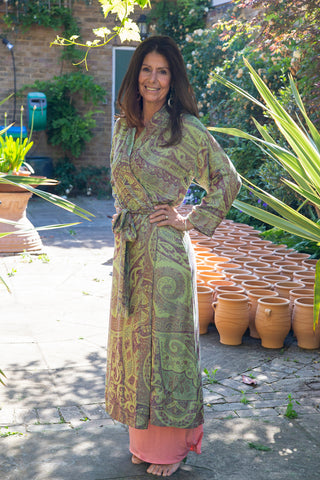 Greta Robe, handwoven in cashmere and silk, in a burgundy-sage paisley, modelled by Stavia
